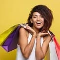 Happy shopper holding her bags